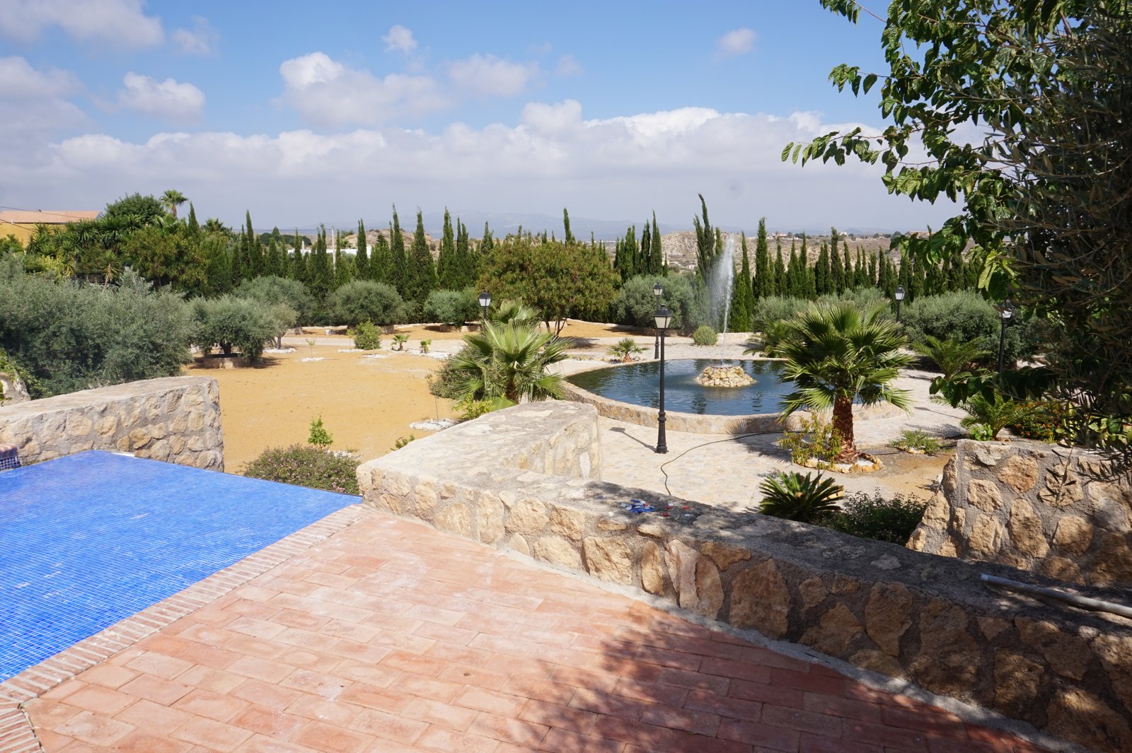 Pool terrace and grounds at Cortijo del Águila